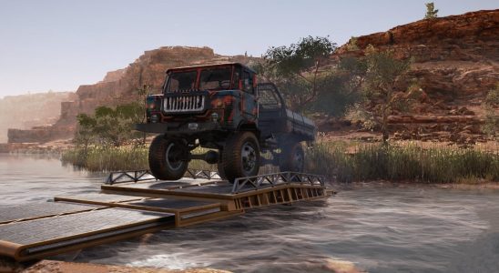 A truck sits pn a narrow bridge across a river in Expeditions: A MudRunner game
