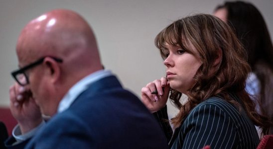 Hannah Gutierrez Reed, center, sits with her attorney Jason Bowles, left, during testimony in the trial against her in First District Court, in Santa Fe, N.M., Friday, March, 1, 2024. Gutierrez-Reed, who was working as the armorer on the movie "Rust" when a revolver actor Alec Baldwin was holding fired killing cinematographer Halyna Hutchins and wounded the film’s director Joel Souza, is charged with involuntary manslaughter and tampering with evidence.