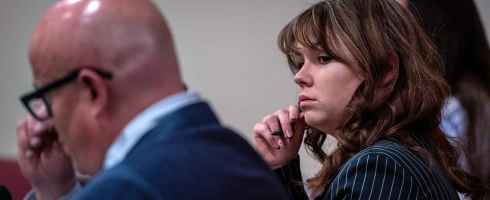 Hannah Gutierrez Reed, center, sits with her attorney Jason Bowles, left, during testimony in the trial against her in First District Court, in Santa Fe, N.M., Friday, March, 1, 2024. Gutierrez-Reed, who was working as the armorer on the movie "Rust" when a revolver actor Alec Baldwin was holding fired killing cinematographer Halyna Hutchins and wounded the film’s director Joel Souza, is charged with involuntary manslaughter and tampering with evidence.