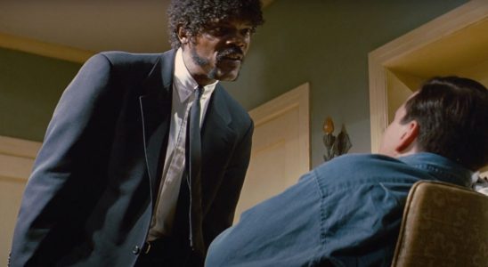 Samuel L Jackson looms over someone sitting in a chair beneath him in Pulp Fiction.