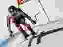 Valérie Grenier du Canada dévale le parcours à toute vitesse lors d'une course de ski alpin de descente de la Coupe du monde féminine, à Cortina d'Ampezzo, en Italie, le samedi 27 janvier 2024. La star canadienne du ski Grenier dit qu'elle aura besoin de plusieurs interventions chirurgicales après une grave chute lors une course de super-G de Coupe du monde dimanche à Cortina D'ampezzo, en Italie.