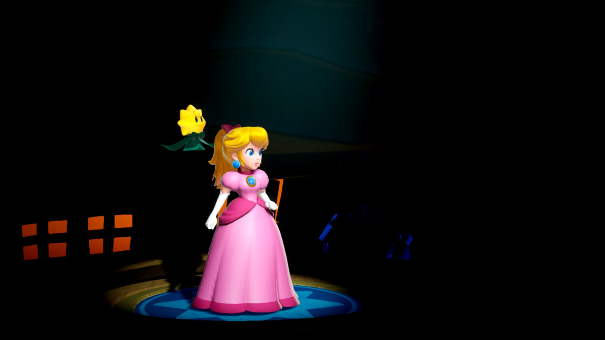 Les projecteurs sont braqués sur la princesse Peach, vêtue de sa robe rose emblématique, avec un acolyte scintillant qui plane derrière elle.