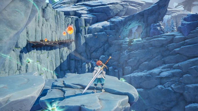 Capture d'écran du protagoniste de Visions of Mana debout sur une falaise rocheuse dans une zone montagneuse