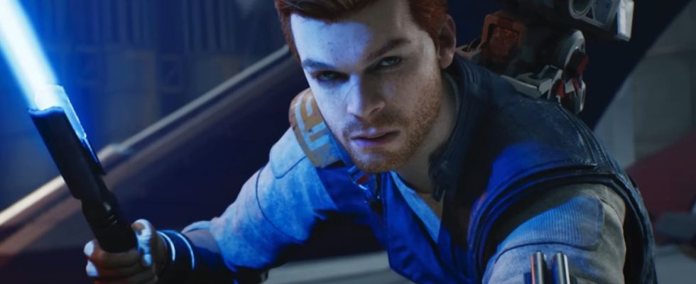Cameron Monaghan poses with a lit lightsaber in Star Wars: Jedi Survivor.