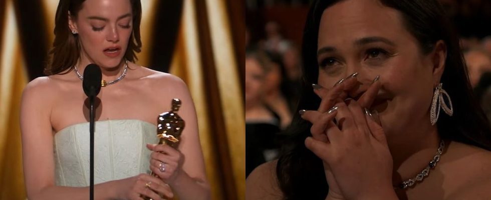 Emma Stone accepting Oscar while Lily Gladstone watches