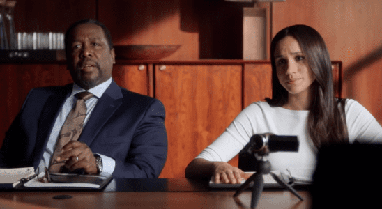 Wendell Pierce and Meghan Markle sitting at table in Suits