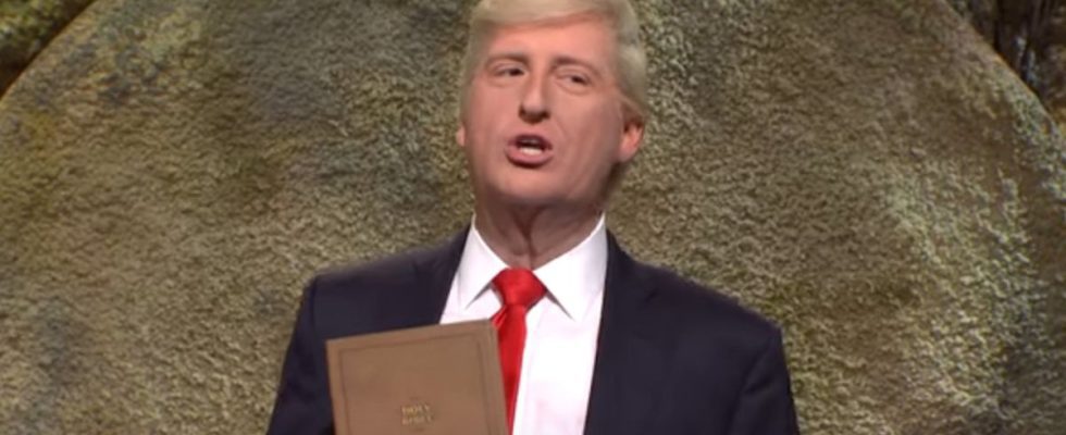James Austin Johnson as Donald Trump selling Bibles in a suit on SNL.