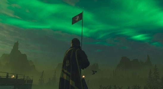 Helldivers 2 screenshot of a player in front of a flag, looking at the glowing sky